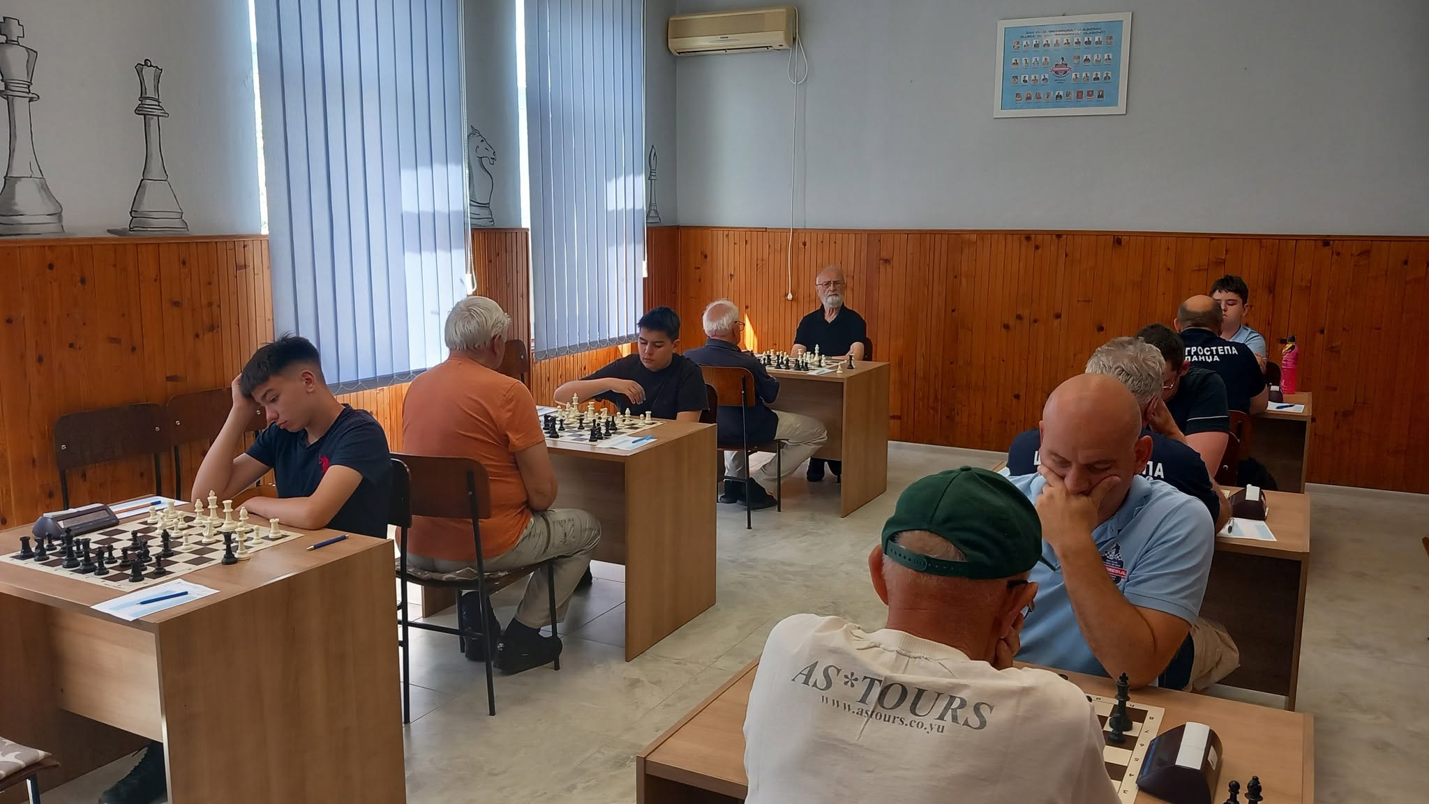 photo of chess players in tournament
