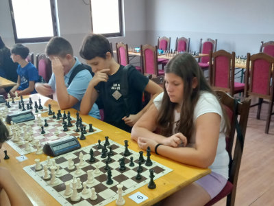 photo of chess players in kids rapid tournament