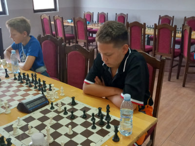 photo of chess players in kids rapid tournament