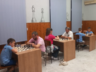 photo of chess players in tournament