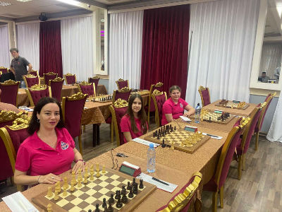 photo of chess players in tournament