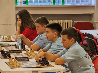 photo of chess players in tournament