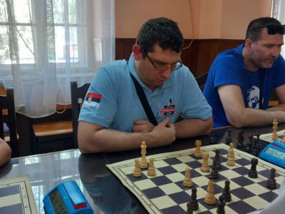 photo of chess players in tournament